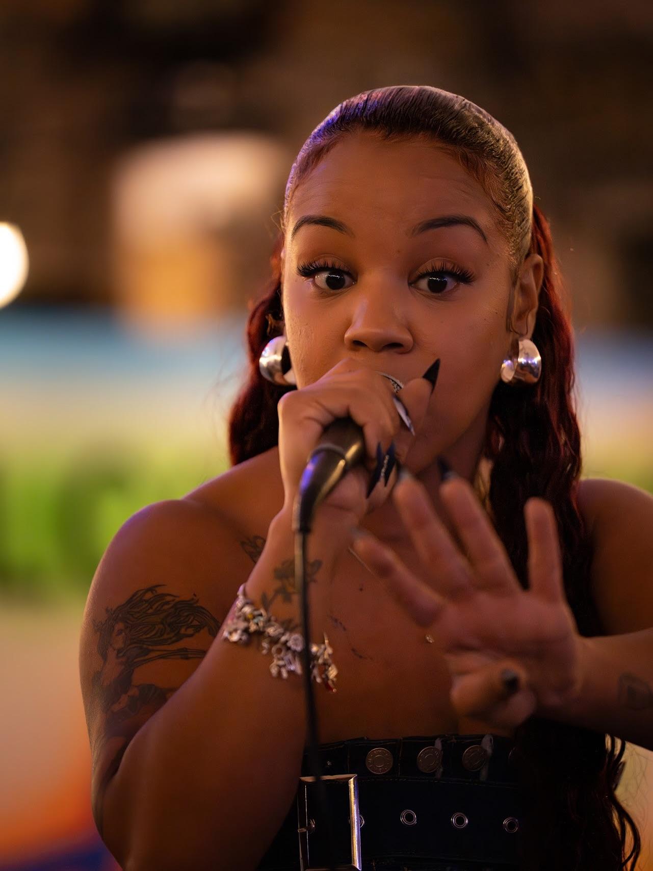 B.Ankha performing live, close up at the microphone